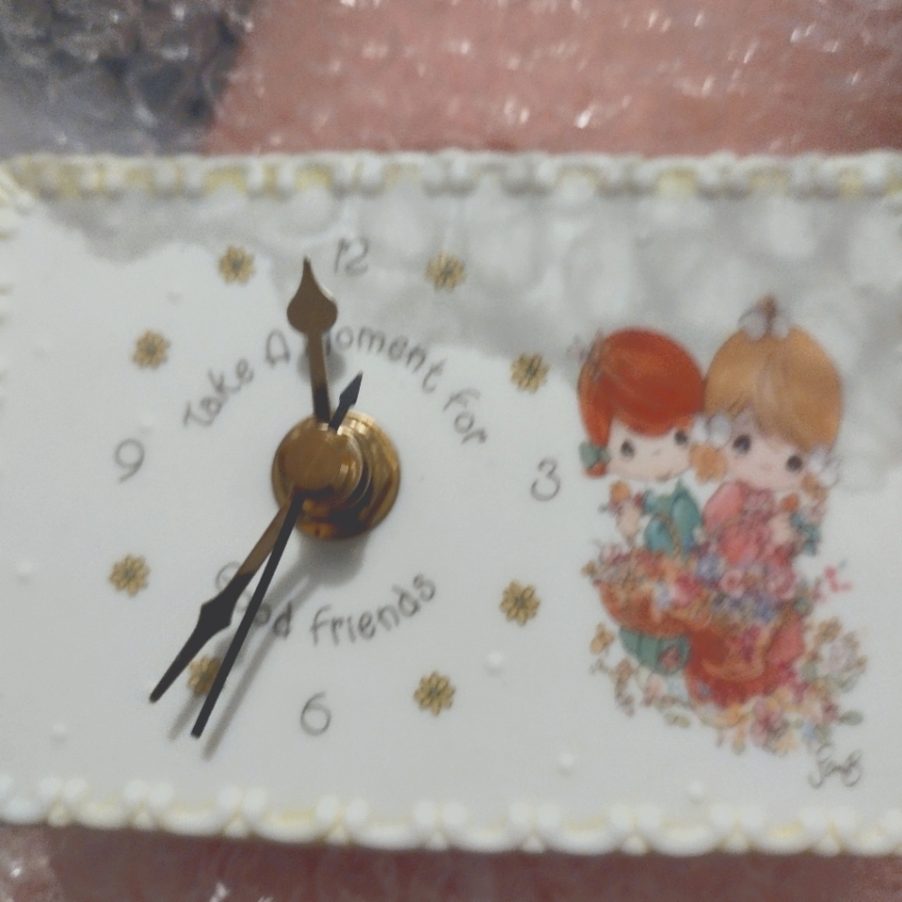 Precious moments clock (retired )